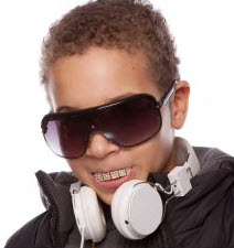 Boy wearing a hip hop grill on his teeth