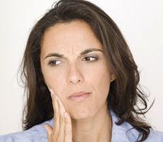 a woman with a toothache