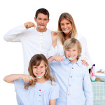 Family brushing their teeth