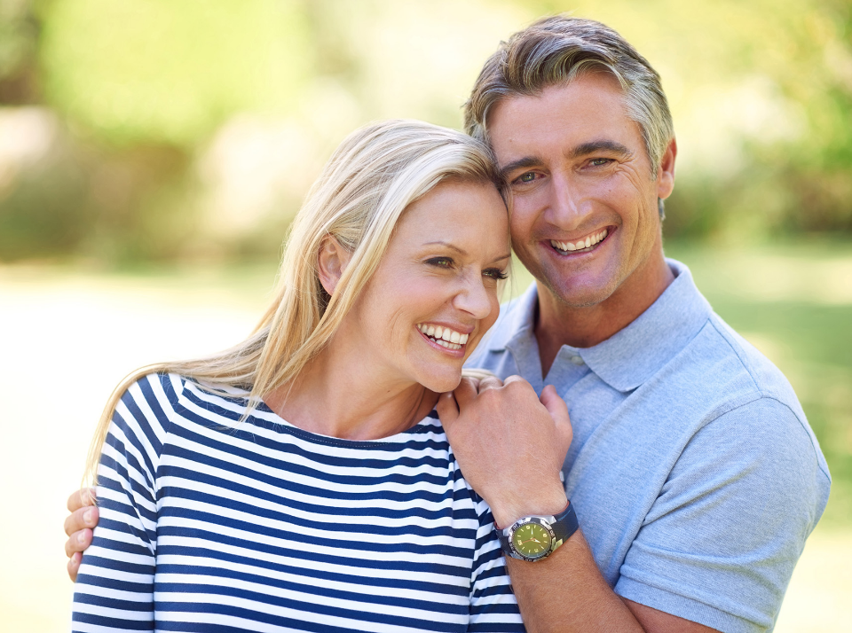 Patient wearing Snap-On Dentures after implant treatment at Shine Dental Associates in Syosset NY